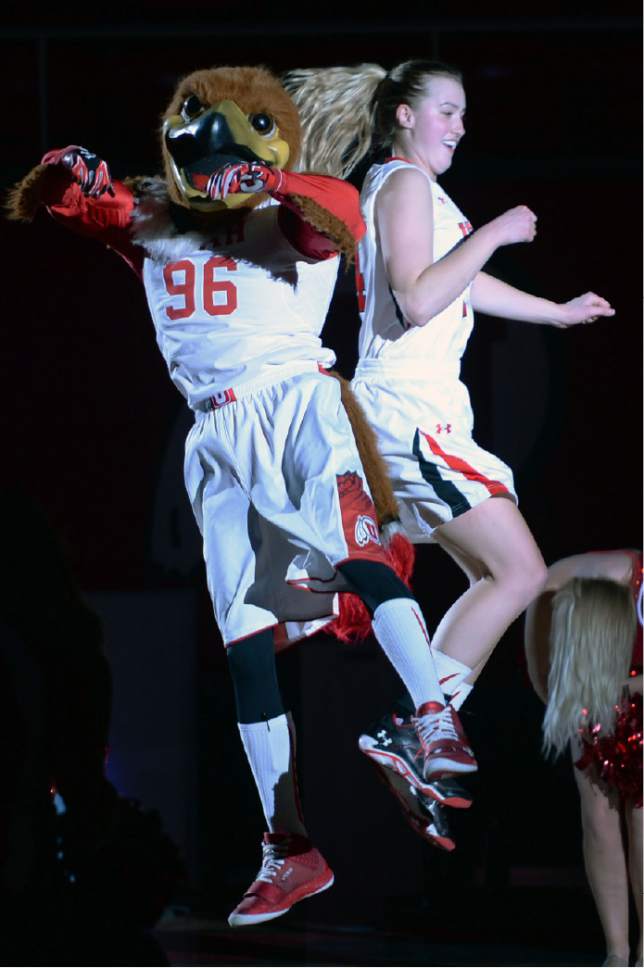 Steve Griffin  |  The Salt Lake Tribune

Utah Utes guard Paige Crozon (14) leaps into the air with Swoop during the pregame starting lineup in the Utah versus Idaho State women's basketball game at the Huntsman Center on the University of Utah campus in Salt Lake City, Wednesday, December 10, 2014.