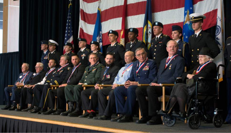 Steve Griffin / The Salt Lake Tribune


Members of the University of Utah ROTC stand with the 11 honorees in this year's Veteran's Day Ceremony in the ballroom of the Union Building on the University of Utah campus in Salt Lake City Friday November 11, 2016.