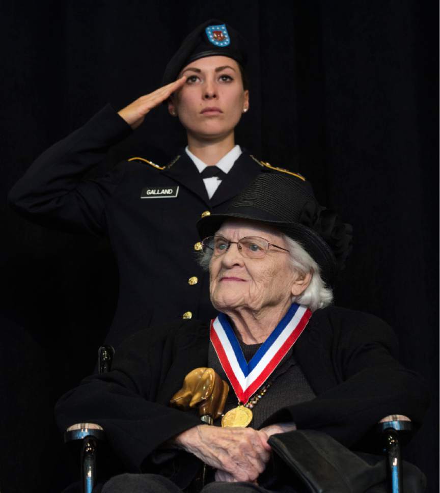 Steve Griffin / The Salt Lake Tribune


University of Utah Army ROTC Cadet Corinne Galland salutes as Donna Mecham is honored during the University of Utah Veteran's Day Ceremony in the ballroom of the Union Building on the University of Utah campus in Salt Lake City Friday November 11, 2016. First Lieutenant Mecham grew up in rural Michigan and began her Army nursing career in 1943 in North Africa.
