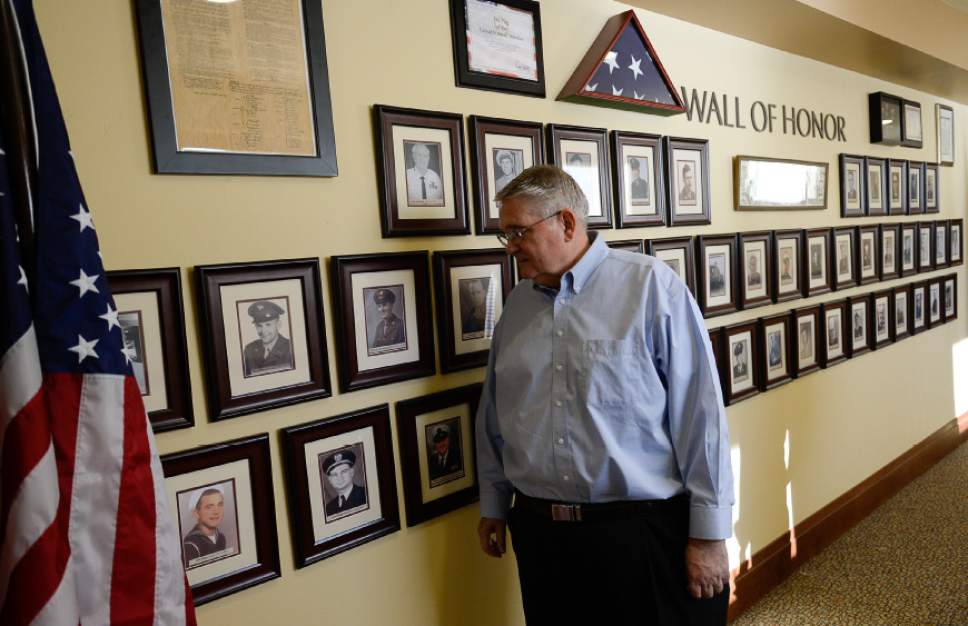 Francisco Kjolseth  |  The Salt Lake Tribune
Sam Burggraaf visits the Wall of Honor at his father's retirement home in South Jordan that includes a portrait of his father, Max, bottom second from left, along with other service members.