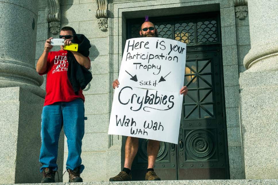 Chris Detrick  |  The Salt Lake Tribune
Pro-Trump supporters hold signs at an anti-Trump rally at the Utah State Capitol during the 'Salt Lake City Protests Trump' event Saturday November 12, 2016.