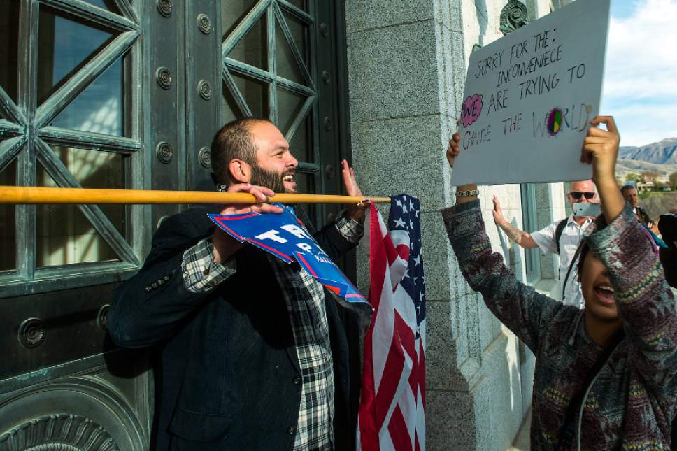 Chris Detrick  |  The Salt Lake Tribune
Pro-Trump supporter Kern Carlos Huerta argues with anti-Trump protestors at the Utah State Capitol during the 'Salt Lake City Protests Trump' event Saturday November 12, 2016.