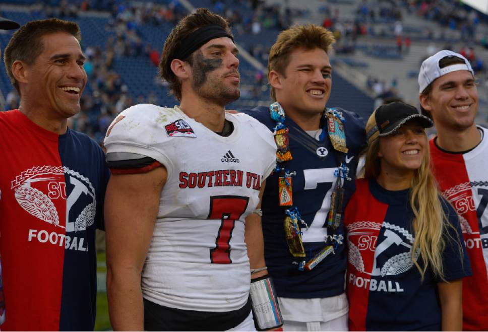 Leah Hogsten  |  The Salt Lake Tribune
Gordon Hannemann (left) and family members pose for pictures with sons Southern Utah Thunderbirds safety Kyle Hannemann (7) and Brigham Young Cougars defensive back Micah Hannemann (7). Brigham Young University defeated Southern Utah University 37-7 during their first match up at LaVell Edwards Stadium,  Saturday, November 12, 2016.