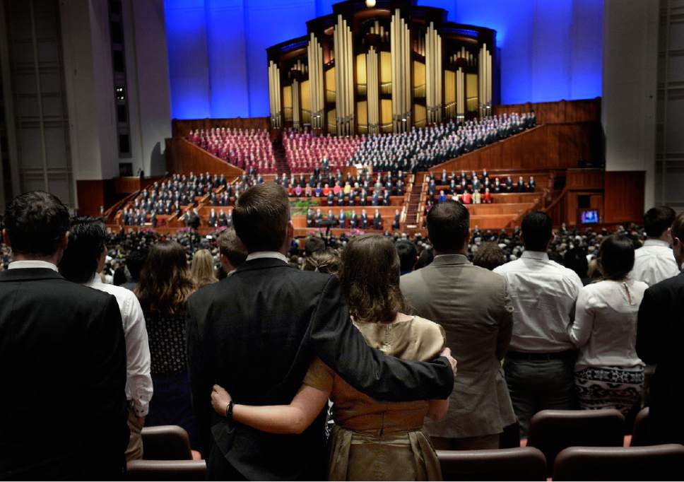 Scott Sommerdorf   |  The Salt Lake Tribune
A couple holds each other as they listen to the Mormon Tabernacle Choir sing during a break at the 185th Semiannual General Conference, Sunday, October 4, 2015.