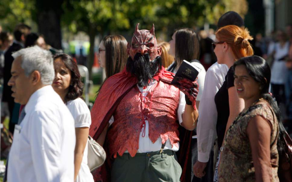 Francisco Kjolseth  |  The Salt Lake Tribune
Dressed as the devil, "James the Preacher" who would not give his real name because he claims he has received death threats stands outside of the Conference Center as he protests the Church of Jesus Christ of Latter Day Saints who were attending the first session 180th semiannual General Conference on Saturday, Oct. 2, 2010.
Salt Lake City Oct. 2, 2010.