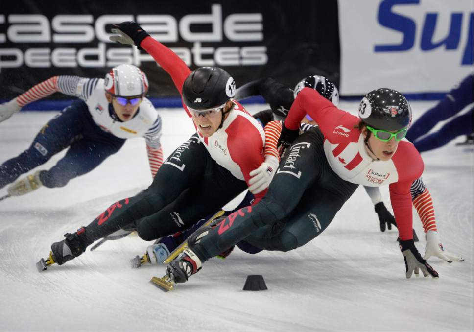 Scott Sommerdorf   |  The Salt Lake Tribune  
Canadians Pascal Dione, left, and Charle Cournoyer run into some rough traffic with Korean Seungsoo Han sandwiched between them during the Men's 1500m semi-final at the World Cup Short Track race at the Utah Olympic Oval, Sunday, November 13, 2016. Judges ruled that Seungsoo Han would be disqualified for the obstruction.
