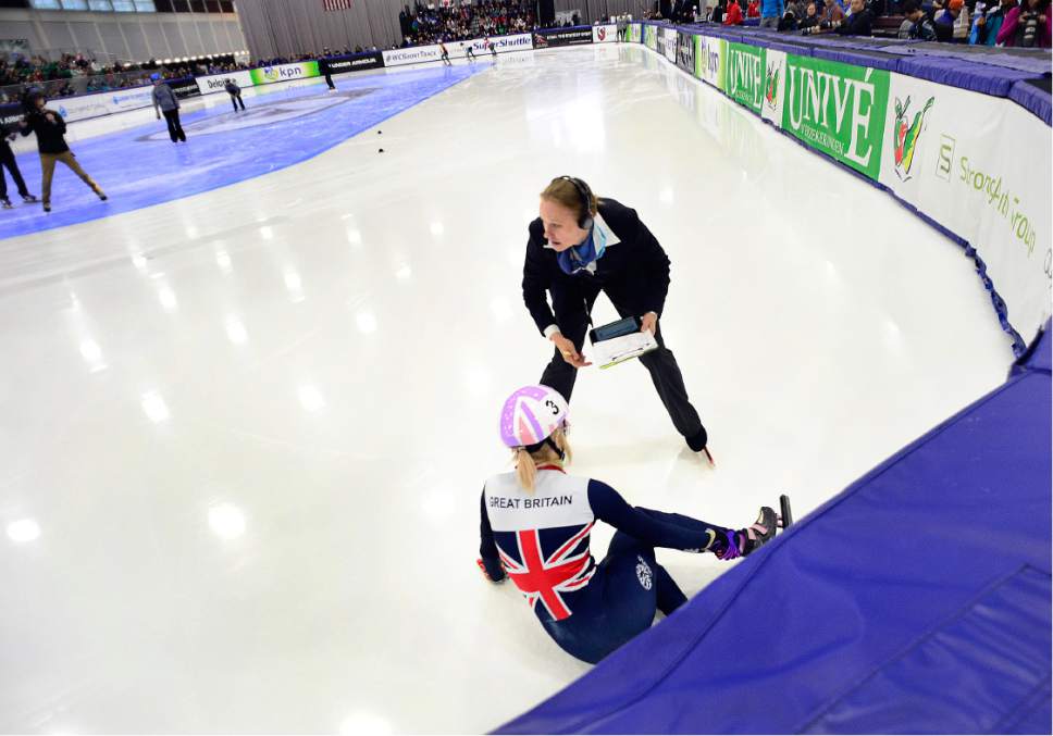 Scott Sommerdorf   |  The Salt Lake Tribune  
Race officials come o the aid of Elise Christie of the United Kingdom who fell during the Women's 500m final race at the World Cup Short Track race at the Utah Olympic Oval, Sunday, November 13, 2016. Earlier Christie broke the world record in the Women's 500m with a time of 42.335 in the quarter-final race at the