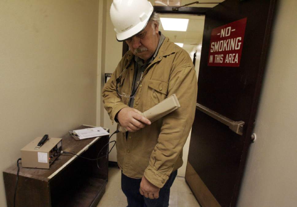 Blanding, UT.  Rich Bartlett, White Mesa mill superintendent, checks himself for radiation contamination before exiting the mill that processes uranium outside Blanding,  Utah. 5/23/07  Jim Urquhart/Salt Lake Tribune