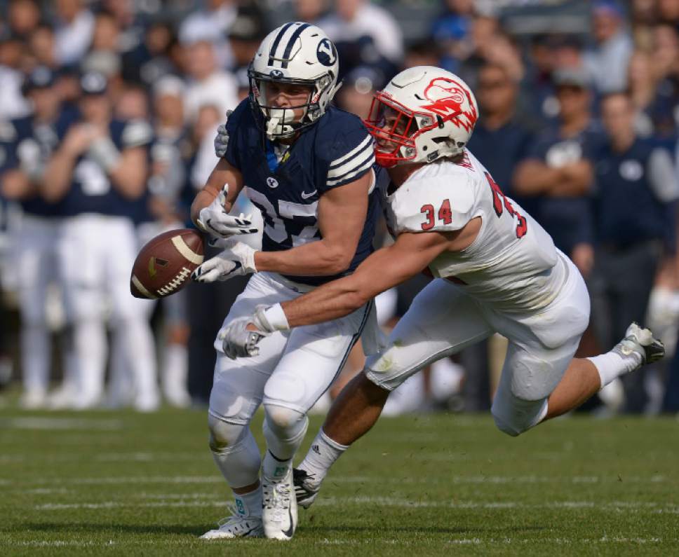 Leah Hogsten  |  The Salt Lake Tribune
Brigham Young Cougars wide receiver Mitchell Juergens (87) has the ball knocked out of his hands by Southern Utah Thunderbirds linebacker Mike Needham (34). Brigham Young University leads Southern Utah University 31-7 during their first match up at LaVell Edwards Stadium,  Saturday, November 12, 2016.