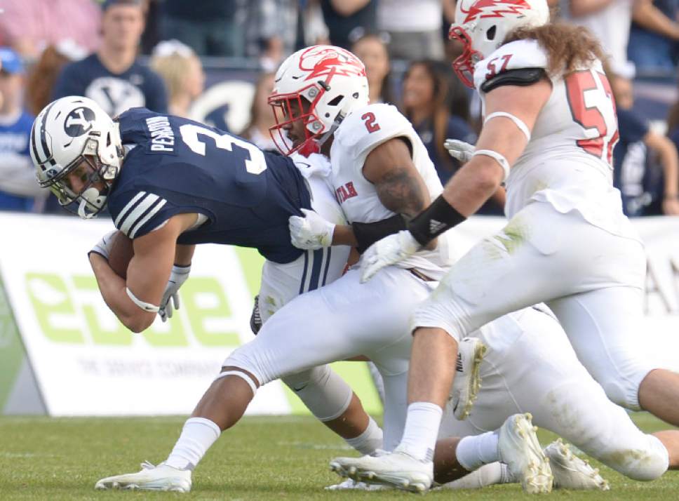 Leah Hogsten  |  The Salt Lake Tribune
Brigham Young Cougars wide receiver Colby Pearson (3) keeps driving as Southern Utah Thunderbirds cornerback Josh Thornton (2) drags him down. Brigham Young University defeated Southern Utah University 37-7 during their first match up at LaVell Edwards Stadium,  Saturday, November 12, 2016.