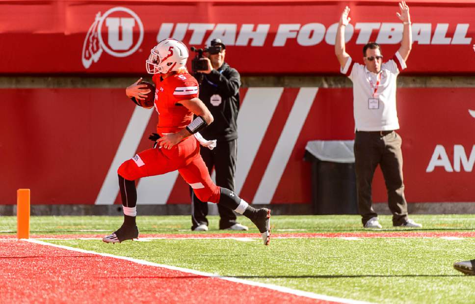 Trent Nelson  |  The Salt Lake Tribune
East quarterback Benjamin Ford scores a touchdown as East faces Maple Mountain in a 4A semifinal high school football game at Rice-Eccles Stadium in Salt Lake City, Friday November 11, 2016.