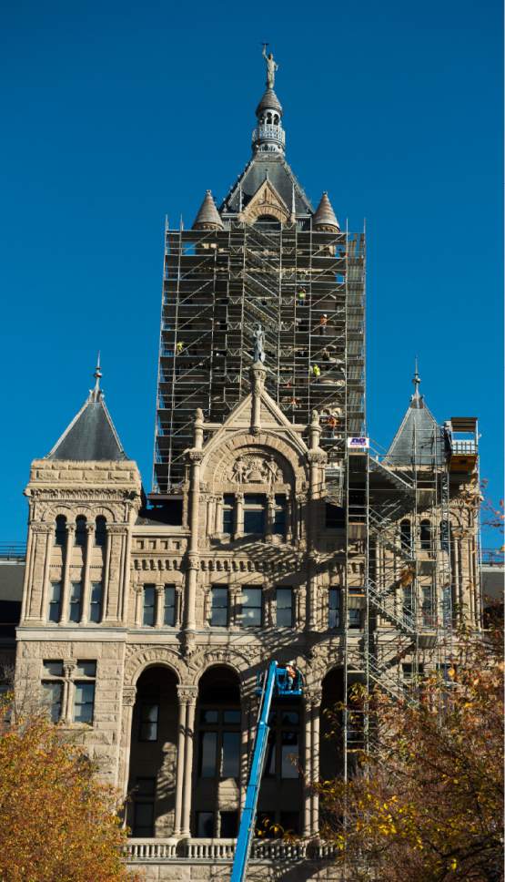 Rick Egan  |  The Salt Lake Tribune

Scaffolding removal has started at the Salt Lake City and County Building upper tower, Monday, November 14, 2016.