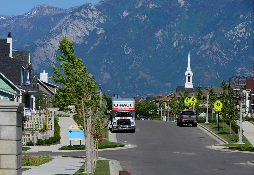 Scott Sommerdorf   |  Tribune file photo  
A moving van is parked in one of the neighborhoods near an LDS ward house in the Daybreak community near South Jordan, Friday, June 17, 2016.