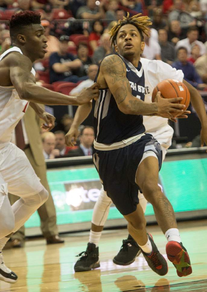 Rick Egan  |  The Salt Lake Tribune

Utah State Aggies guard Shane Rector (4) takes the ball inside, in Mountain West Tournament action, The Utah State Aggies vs. San Diego State Aztecs, at the Thomas and Mack Center in Las Vegas, Thursday, March 10, 2016.