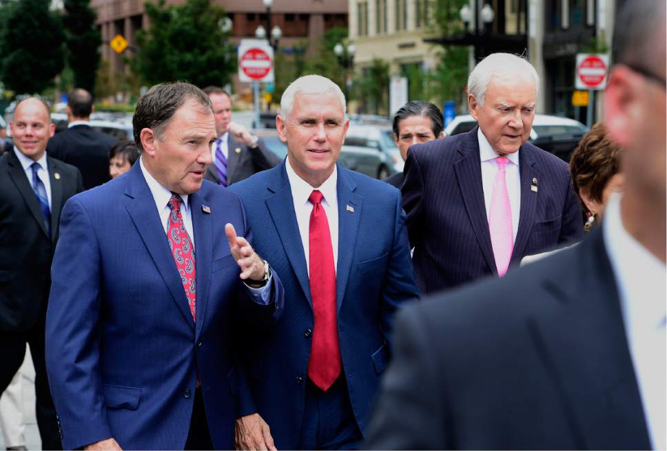 Scott Sommerdorf   |  The Salt Lake Tribune  
Utah Gov. Gary Herbert, Indiana Gov. Mike Pence, and U.S. Sen. Orrin Hatch walk together as a tour of Temple Square begins, Thursday, September 1, 2016.