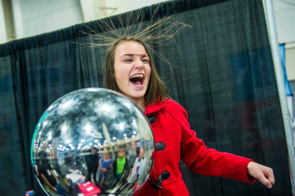 Chris Detrick  |  The Salt Lake Tribune
Mount Jordan Middle School sixth-grader Paige Hendrickson reacts to the electrostatic charge from the Van de Graaff generator the during Utahís Second Annual STEM Fest at South Towne Expo Center Tuesday February 2, 2016.  More than 18,000 seventh through 10th grade students will engage with science, technology, engineering and math (STEM) through interactive experiences.