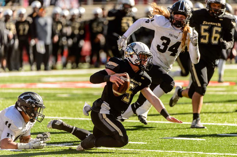 Trent Nelson  |  The Salt Lake Tribune
Desert Hills' Quinn Kiser is brought down by Pine View's Christian Reis as Desert Hills faces Pine View in the Class 3AA high school football state championship at Rice-Eccles Stadium in Salt Lake City, Friday November 18, 2016. At right rear is Brennan Bithell.