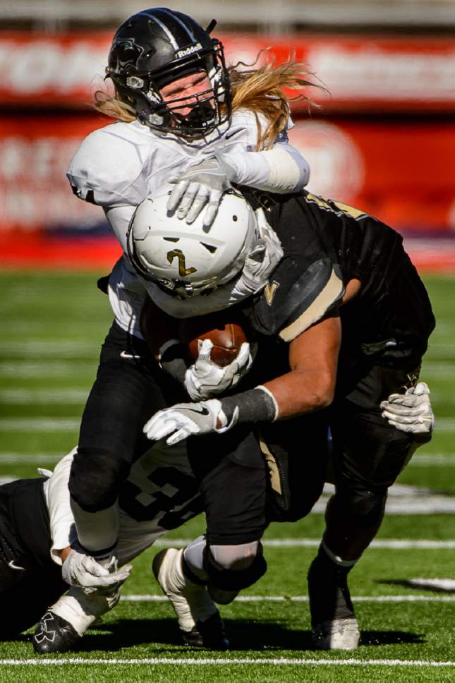 Trent Nelson  |  The Salt Lake Tribune
Desert Hills' Nephi Sewell is brought down hard by Pine View's Brennan Bithell as Desert Hills faces Pine View in the Class 3AA high school football state championship at Rice-Eccles Stadium in Salt Lake City, Friday November 18, 2016.