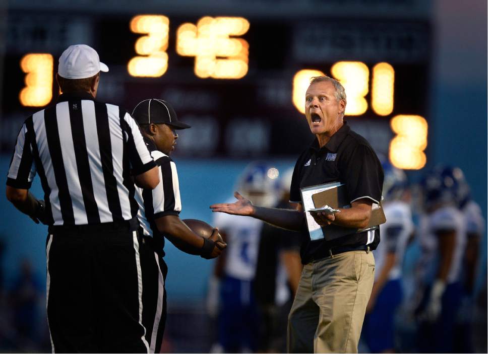 Scott Sommerdorf   |  The Salt Lake Tribune  
Bingham head coach John Lambourne argues a call during first half play. Bingham led Lone Peak 21-9 at the half, Friday, September 2, 2016.