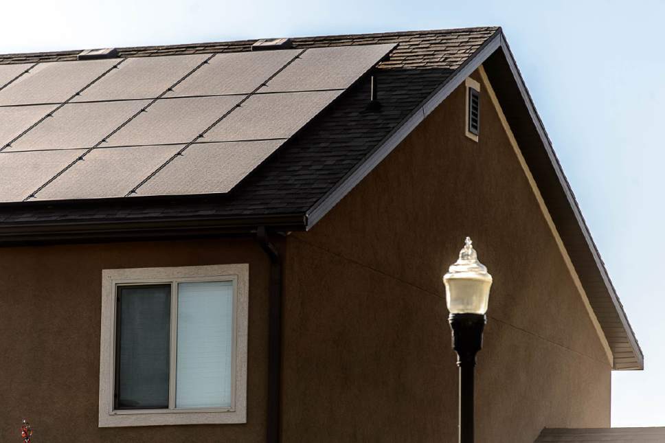 Trent Nelson  |  The Salt Lake Tribune
Solar panels on the roof of a Farmington home, Thursday July 14, 2016. Based on the first quarter, Utah is on track to have more rooftop solar installed in 2016 than in all previous years combined. Adopters say that's because, in the last few months, it's become possible to replace your entire power bill with solar panels--and with state and federal tax credits in place for at least the next year, it's still possible to get the government to refund you almost half the cost.
