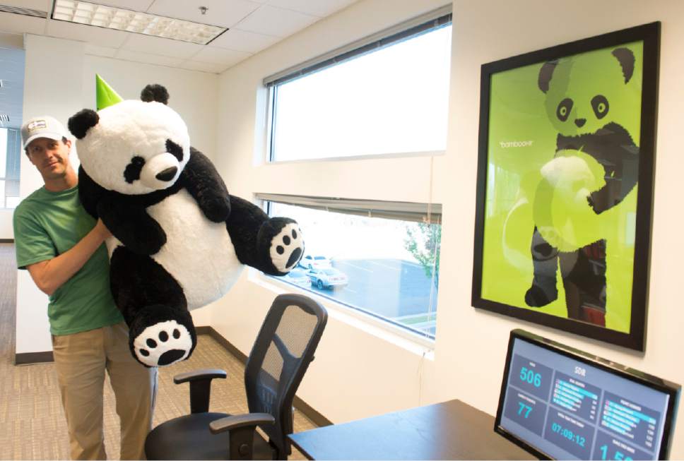 Rick Egan  |  Tribune file photo
CEO Ben Peterson holds a toy panda head in the office of BambooHR in 2014.
