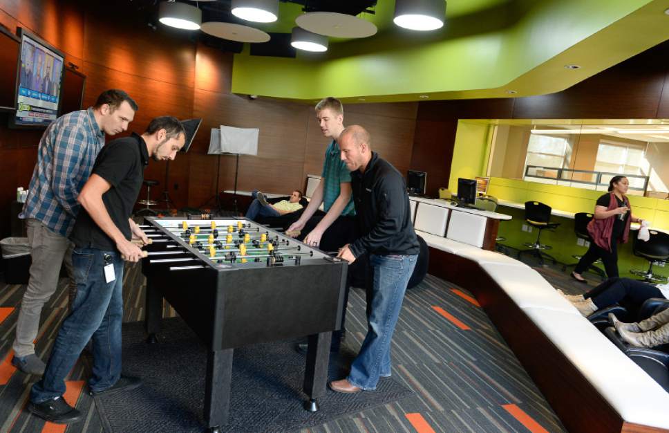 Francisco Kjolseth | The Salt Lake Tribune
Kyle McDonald, left, Orlando Accetty, Lyman Rasmussen and Randy Tarbet, all members of the IT department, unwind in the lounge of Prestige Financial, a large credit financing company in Salt Lake City.