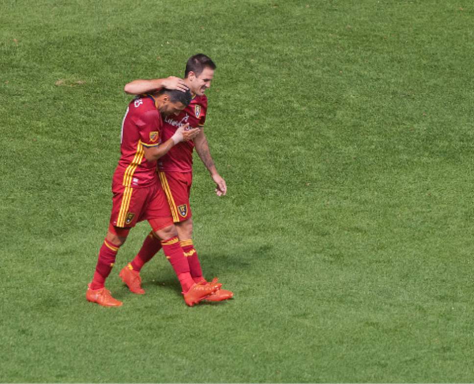 Michael Mangum  |  Special to the Tribune

Real Salt Lake forward Juan Manuel Martinez (7) congratulates midfielder Javier Morales (11) after Morales scored the second of his two goals during their MLS match against the Chicago Fire at Rio Tinto Stadium in Sandy, Utah on Saturday, August 6th, 2016.