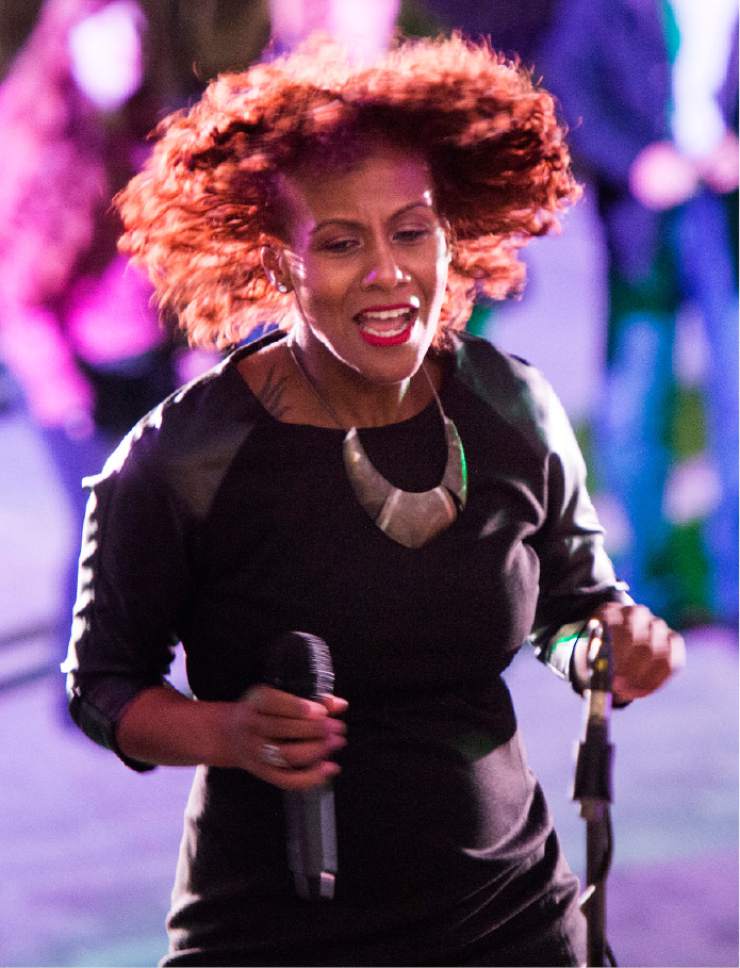 Rick Egan  |  The Salt Lake Tribune

Frieda dances as she sings with the band "Changing Lanes" entertains the crowd at the 16th annual "Light Up The Night" Christmas tree lighting party, Saturday, November 19, 2016.