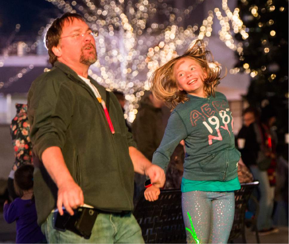 Rick Egan  |  The Salt Lake Tribune

Derrick Venimon dances with his 10-year-old daughter, Teagen, at the16th annual "Light Up The Night" Christmas tree lighting party, Saturday, November 19, 2016.