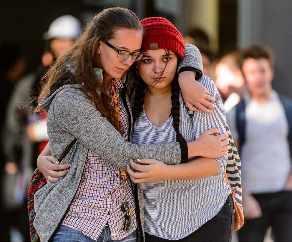 Trent Nelson  |  The Salt Lake Tribune
Students Holly Hilton and Albany Cox embrace after a 16-year-old boy allegedly stabbed several other male students before reportedly turning his knife on himself at Mountain View High School in Orem Tuesday November 15, 2016.