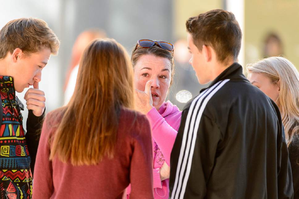 Trent Nelson  |  The Salt Lake Tribune
Parent Alicia Ransom speaks with students, including her son Paxton (at right) after a 16-year-old boy allegedly stabbed several other male students before reportedly turning his knife on himself at Mountain View High School in Orem Tuesday November 15, 2016.