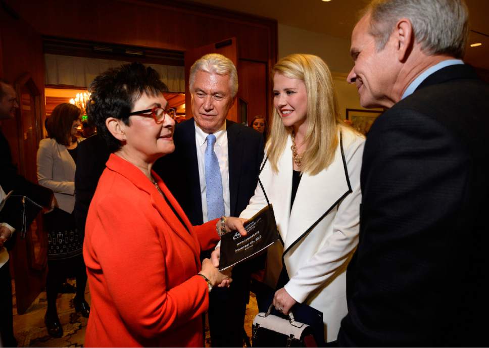 Scott Sommerdorf   |  The Salt Lake Tribune  
Harriet Reich Uchtdorf, left, wife of LDS President Dieter F. Uchtdorf, center, greets Elizabeth Smart and her father, Ed Smart at a reception prior to the Catholic Community Services of Utah Humanitarian Awards dinner at the Little America Hotel, Friday, November 4, 2016.