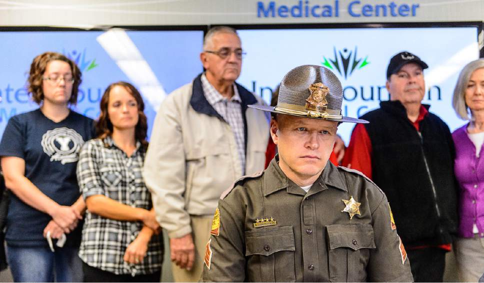 Trent Nelson  |  The Salt Lake Tribune
Utah Highway Patrol Trooper Todd Royce sits in front of family members of Utah Highway Patrol Trooper Eric Ellsworth, during a press conference at Intermountain Medical Center in Murray, Tuesday November 22, 2016. Ellsworth was critically injured Friday when a car struck him while he was assisting at the scene of a Box Elder County emergency.