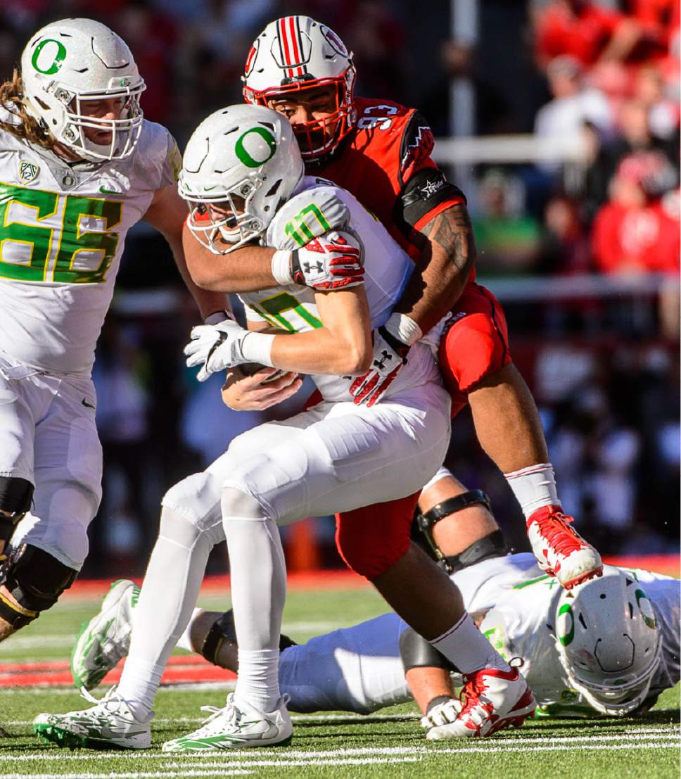 Trent Nelson  |  The Salt Lake Tribune
Utah Utes defensive tackle Lowell Lotulelei (93) sacks Oregon Ducks quarterback Justin Herbert (10) as Utah hosts Oregon, NCAA football at Rice-Eccles Stadium in Salt Lake City, Saturday November 19, 2016.