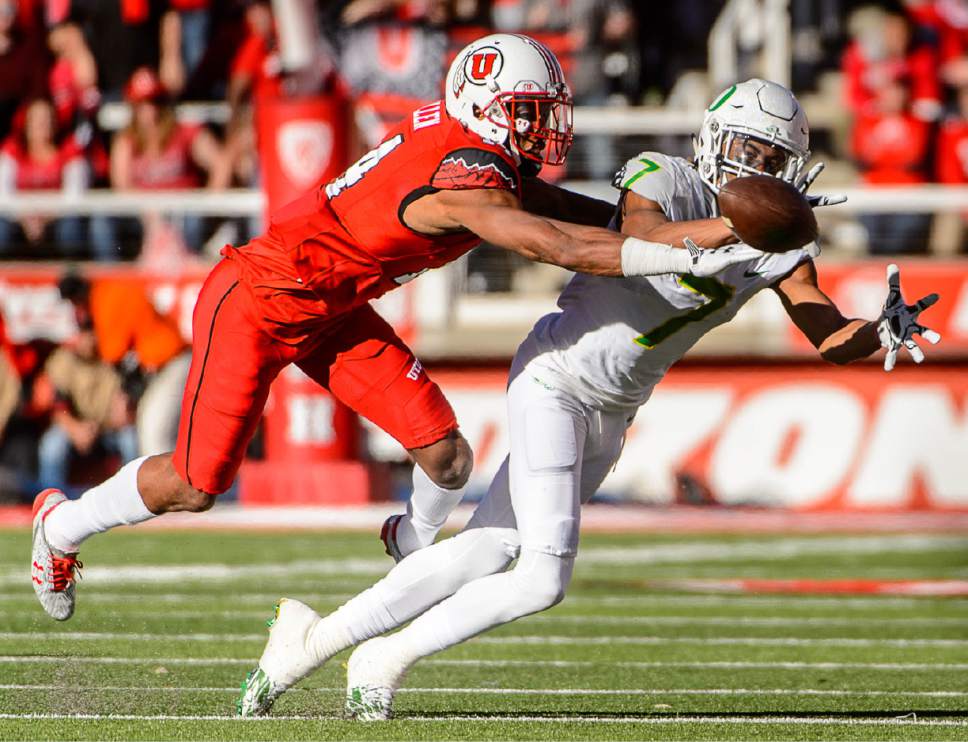 Trent Nelson  |  The Salt Lake Tribune
Oregon Ducks wide receiver Darren Carrington II (7) dives unsuccessfully for a pass, with Utah Utes defensive back Brian Allen (14) defending as Utah hosts Oregon, NCAA football at Rice-Eccles Stadium in Salt Lake City, Saturday November 19, 2016.