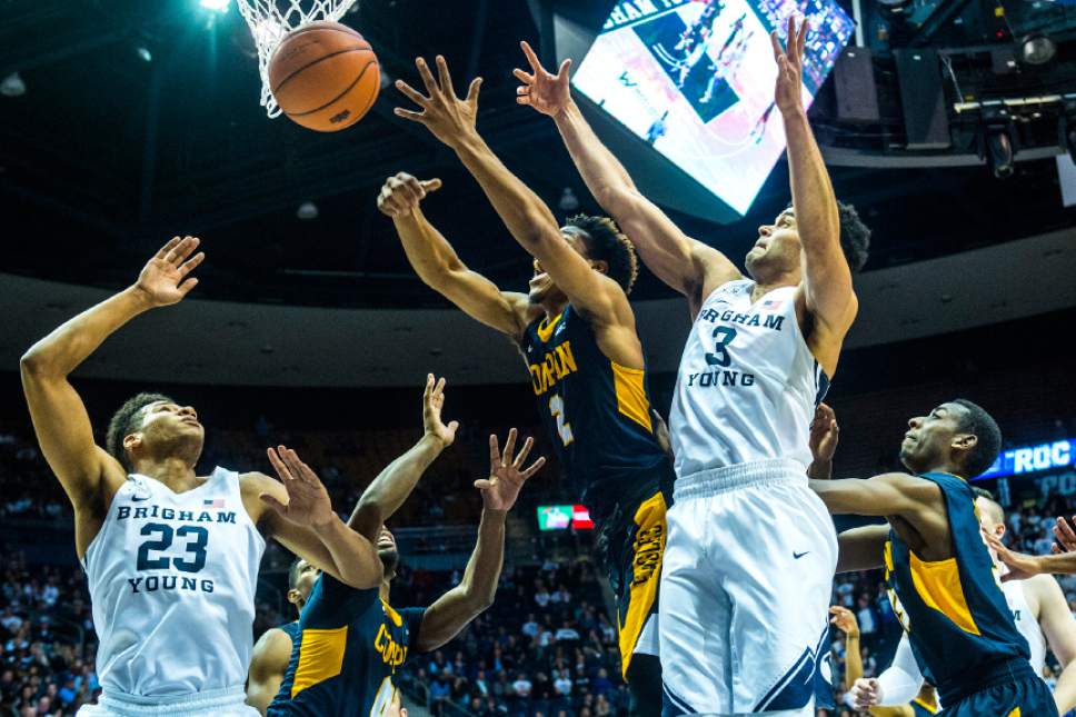 Chris Detrick  |  The Salt Lake Tribune
Brigham Young Cougars forward Yoeli Childs (23) Coppin State Eagles guard Rasool Hinson (0) Coppin State Eagles guard Juwan Davenport (2) and Brigham Young Cougars guard Elijah Bryant (3) go for a rebound during the game at the Marriott Center Thursday November 17, 2016.