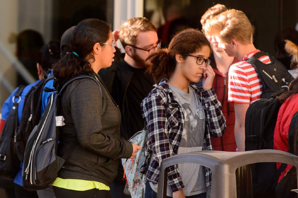 Trent Nelson  |  The Salt Lake Tribune
Students gather after a 16-year-old boy allegedly stabbed several other male students before reportedly turning his knife on himself at Mountain View High School in Orem last week.
