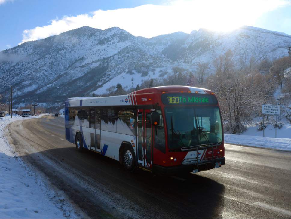 Al Hartmann  |  Tribune file photo
A UTA ski bus comes down Big Cottonwood Canyon after dropping off skiers at the resorts in February. UTA is floating a plan to do away with direct ski bus service from downtown Salt Lake City, requiring skiers using mass transit to transfer from TRAX to buses. The transit agency says the change would allow it to run more frequent bus service up the canyons to ski resorts.