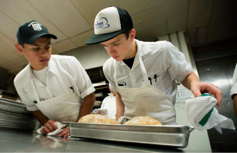 Steve Griffin / The Salt Lake Tribune


Alan Hurtado and Seth Carroll who are students in the Utah Restaurant Association's ProStart Culinary training program, keep an eye on the cooking temperature of turkeys, as students help prepare Thanksgiving dinner for more than 1,000 families. For the past several years, the Restaurant Association has collaborated with the Salvation Army and Chartwellís Dining Services to provide the holiday meal. The teens prepared more 350 pounds of potatoes and 400 pounds of onions, celery and carrots at the Union Building Kitchen on the University of Utah campus in Salt Lake City Tuesday November 22, 2016.