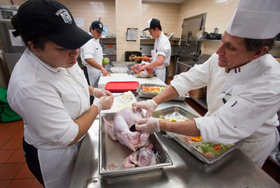Steve Griffin / The Salt Lake Tribune


Jack Jones, right, culinary arts instructor at the Weber Basin Job Core in Ogden, Utah, helps Alondra Medina, who is  part of the Utah Restaurant Association's ProStart Culinary training program, as students help prepare Thanksgiving dinner for more than 1,000 families. For the past several years, the Restaurant Association has collaborated with the Salvation Army and Chartwell's Dining Services to provide the holiday meal. The teens prepared more 350 pounds of potatoes and 400 pounds of onions, celery and carrots at the Union Building Kitchen on the University of Utah campus in Salt Lake City Tuesday November 22, 2016.