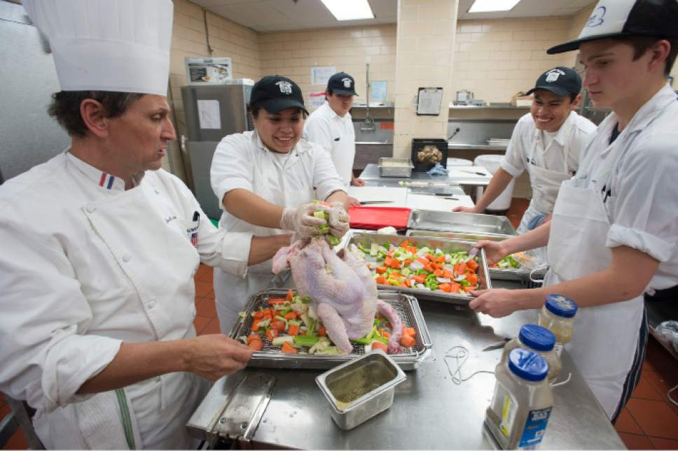Steve Griffin / The Salt Lake Tribune


Jack Jones, left, culinary arts instructor at the Weber Basin Job Core in Ogden, Utah, helps Alondra Medina, Alejandro Pereez, Alan Hurtado and Seth Carroll who are students in the Utah Restaurant Association's ProStart Culinary training program, as they prepare Thanksgiving dinner for more than 1,000 families. For the past several years, the Restaurant Association has collaborated with the Salvation Army and Chartwellís Dining Services to provide the holiday meal. The teens prepared more 350 pounds of potatoes and 400 pounds of onions, celery and carrots at the Union Building Kitchen on the University of Utah campus in Salt Lake City Tuesday November 22, 2016.