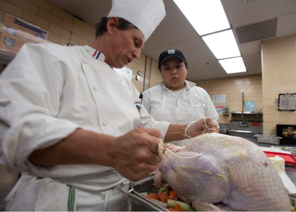 Steve Griffin / The Salt Lake Tribune


Jack Jones, right, culinary arts instructor at the Weber Basin Job Core in Ogden, Utah, helps Alondra Medina, who is  part of the Utah Restaurant Association's ProStart Culinary training program, as students help prepare Thanksgiving dinner for more than 1,000 families. For the past several years, the Restaurant Association has collaborated with the Salvation Army and Chartwell's Dining Services to provide the holiday meal. The teens prepared more 350 pounds of potatoes and 400 pounds of onions, celery and carrots at the Union Building Kitchen on the University of Utah campus in Salt Lake City Tuesday November 22, 2016.