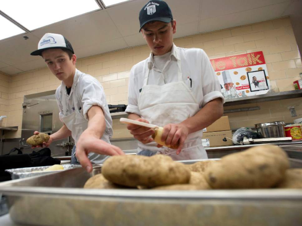 Steve Griffin / The Salt Lake Tribune


Seth Carroll and Alan Hurtado, who are students in the Utah Restaurant Association's ProStart Culinary training program, peel and slice potatoes as students help prepare Thanksgiving dinner for more than 1,000 families. For the past several years, the Restaurant Association has collaborated with the Salvation Army and Chartwell's Dining Services to provide the holiday meal. The teens prepared more 350 pounds of potatoes and 400 pounds of onions, celery and carrots at the Union Building Kitchen on the University of Utah campus in Salt Lake City Tuesday November 22, 2016.