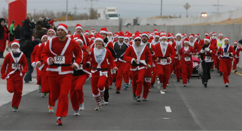 Rick Egan  | The Salt Lake Tribune 

Hundreds of Santas run in the  Santa Run 5K  at Valley Fair Mall, Friday, Nov. 25, 2011.