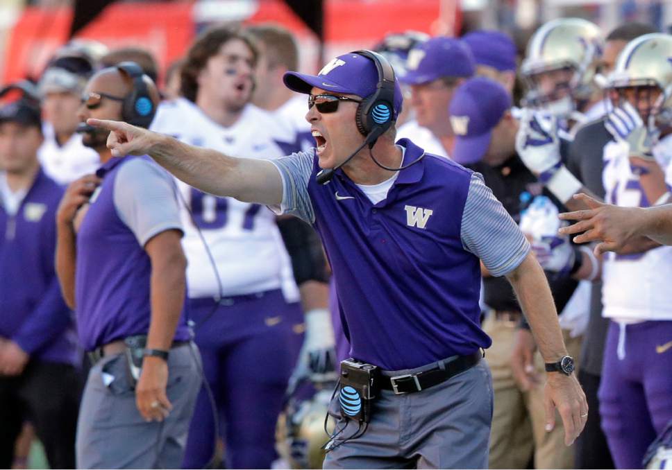 FILE - In this Oct. 29, 2016, file photo, Washington head coach Chris Petersen shouts to his team in the second half of an NCAA college football game against Utah, in Salt Lake City. For Washington's Chris Petersen, college football's most unassuming star coach, Seattle is the perfect place to build a powerhouse program on a foundation of well-ordered priorities. (AP Photo/Rick Bowmer, File)