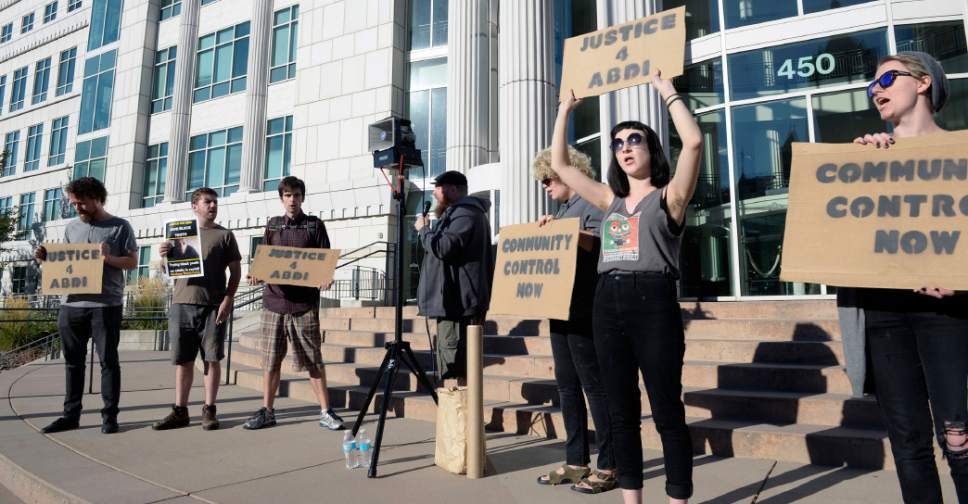 Al Hartmann  |  The Salt Lake Tribune
A dozen people demonstrated in front of Matheson Courthouse in Salt Lake City in September in support of Abdullahi Mohamed who was shot by police near the Road Home shelter in February.