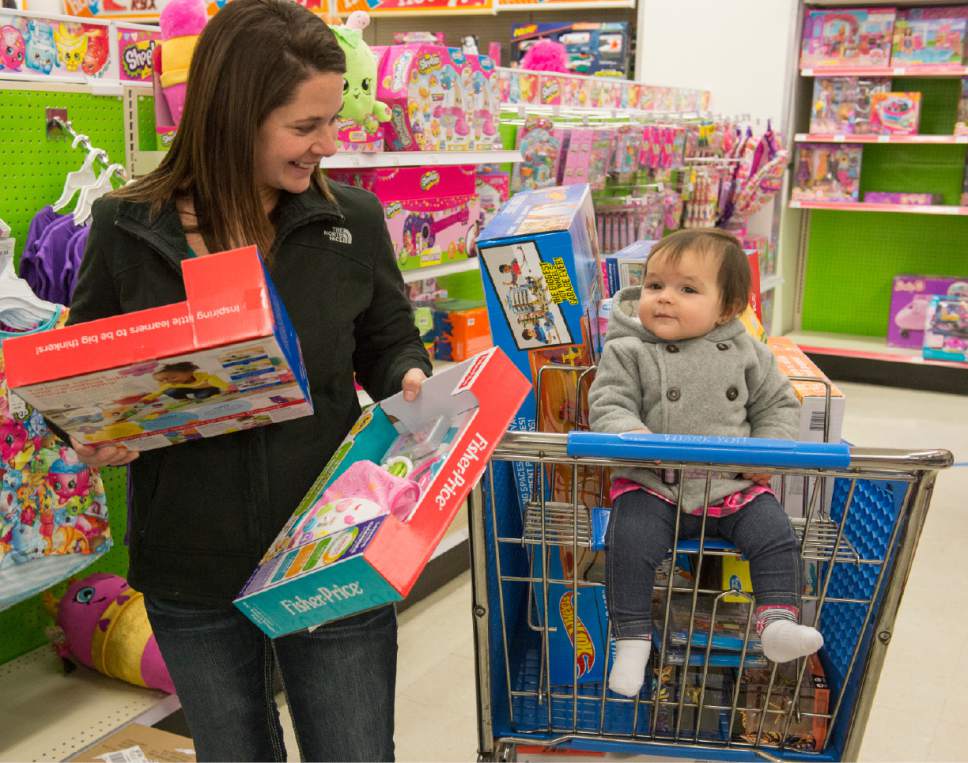 Rick Egan  |  The Salt Lake Tribune

Raven Roper, of Elko Nev., shops for for Black Friday bargains with her 11-month-old daughter Aryana, at Toys R Us in Murray, Friday, November 25, 2016. The Ropers got up at 3:00 to make their drive to Salt Lake to shop the Black Friday sales.