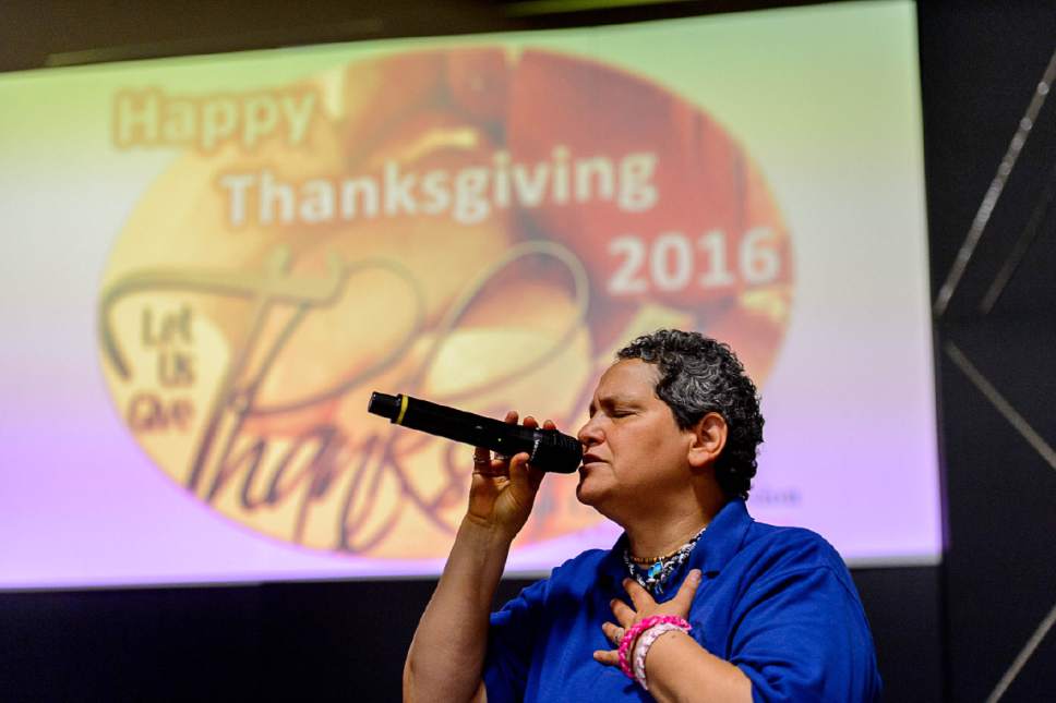 Trent Nelson  |  The Salt Lake Tribune
Monica Wilson sings at the Salt Lake City Mission's Thanksgiving meal for the homeless, in Salt Lake City, Thursday November 24, 2016.