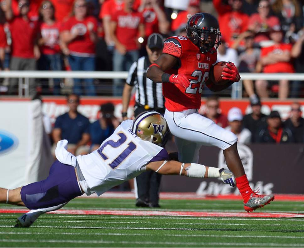 Leah Hogsten  |  The Salt Lake Tribune
Utah Utes running back Joe Williams (28) tries to gain yardage as the minutes tick off in the half. University of Washington Huskies lead University of Utah Utes 14-10 during the first half of their game at Rice-Eccles Stadium, Saturday, October 29, 2016.