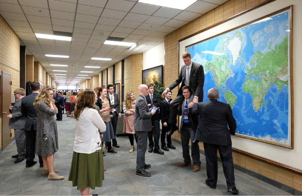 Francisco Kjolseth | The Salt Lake Tribune
Missionaries get a quick picture in front of the world map at the Missionary Training Center in Provo after spending part of their day packaging 350,000 Thanksgiving meals for at-risk children on Thursday, Nov. 24, 2016.